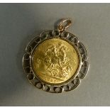 A Victoria 1887 sovereign in gold mount, approximate weight 11gm