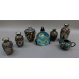 A pair of Japanese cloisonne enamel baluster vases, three other vases, a Japanese cloisonne enamel