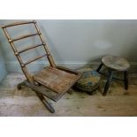 A Victorian folding rail back chair or stool together with a circular footstool with stuffed over