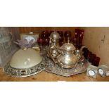 A four piece silver plated tea service together with a silver plated shaped circular tray, a