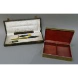 An early 20th century writing set including an ink pen and seal, one item missing; together with a