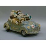 Studio Pottery sculpture of four men in an open top car the registration reading 'MAD4'