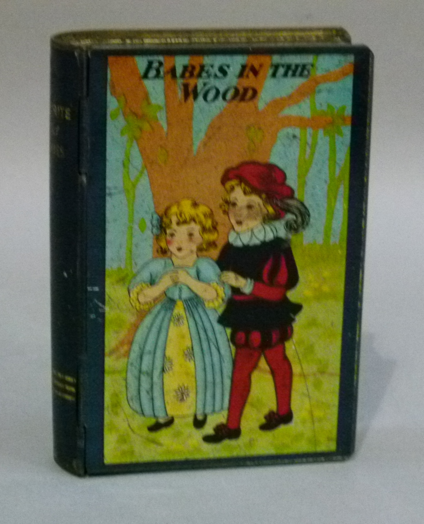 A 'Favourite Fairy Stories, Babes in the Wood' money box in the form of a book, printed tin, 14.