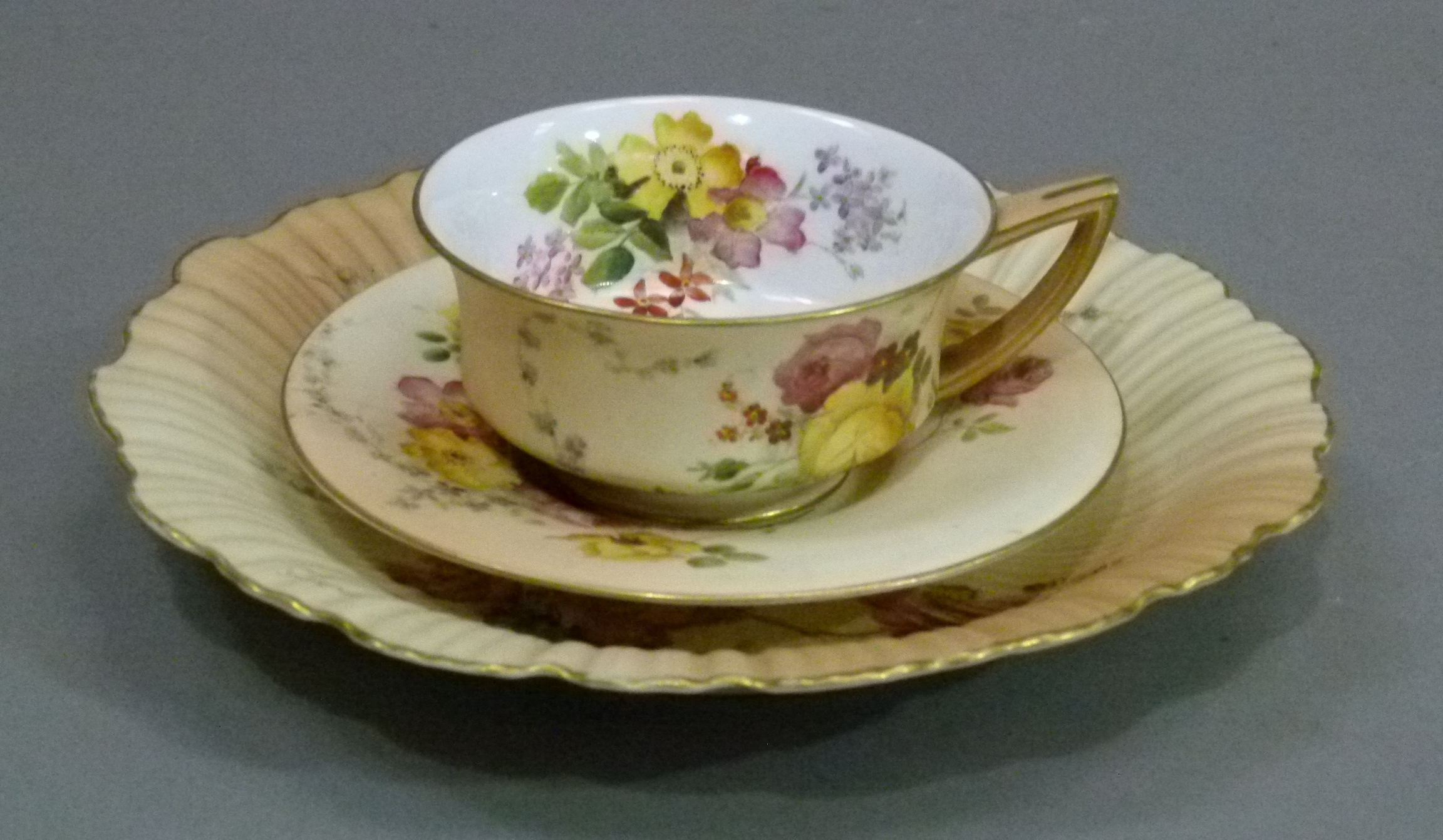 A Royal Worcester shaped circular cabinet plate, painted with floral sprays on a shaded apricot - Image 2 of 5