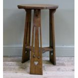 A Liberty octagonal occasional table on three tapered flat legs pierced with heart shaped motifs