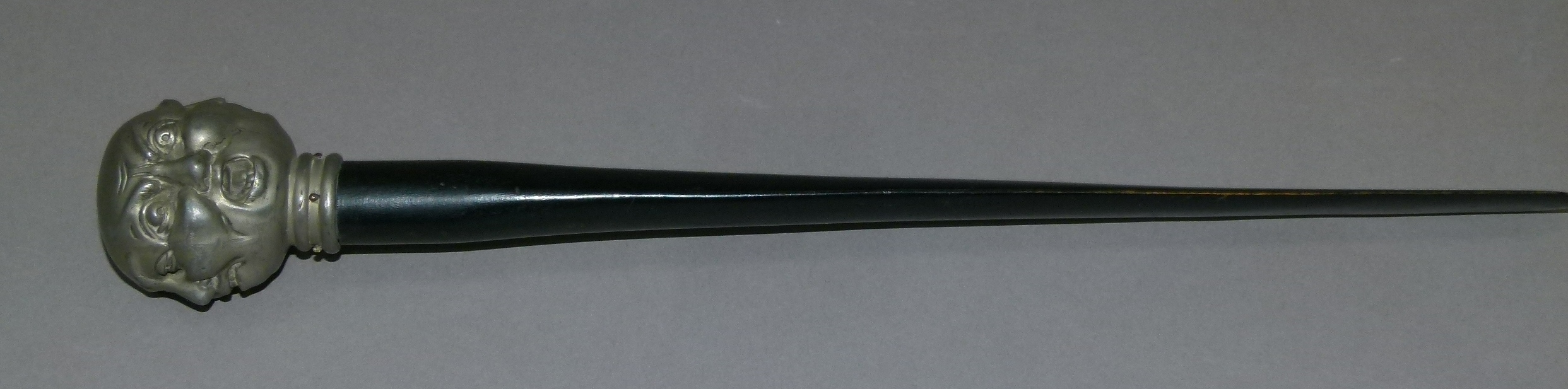 A letter opener with white metal pommel cast as four grotesque faces, 36cm long - Image 2 of 8