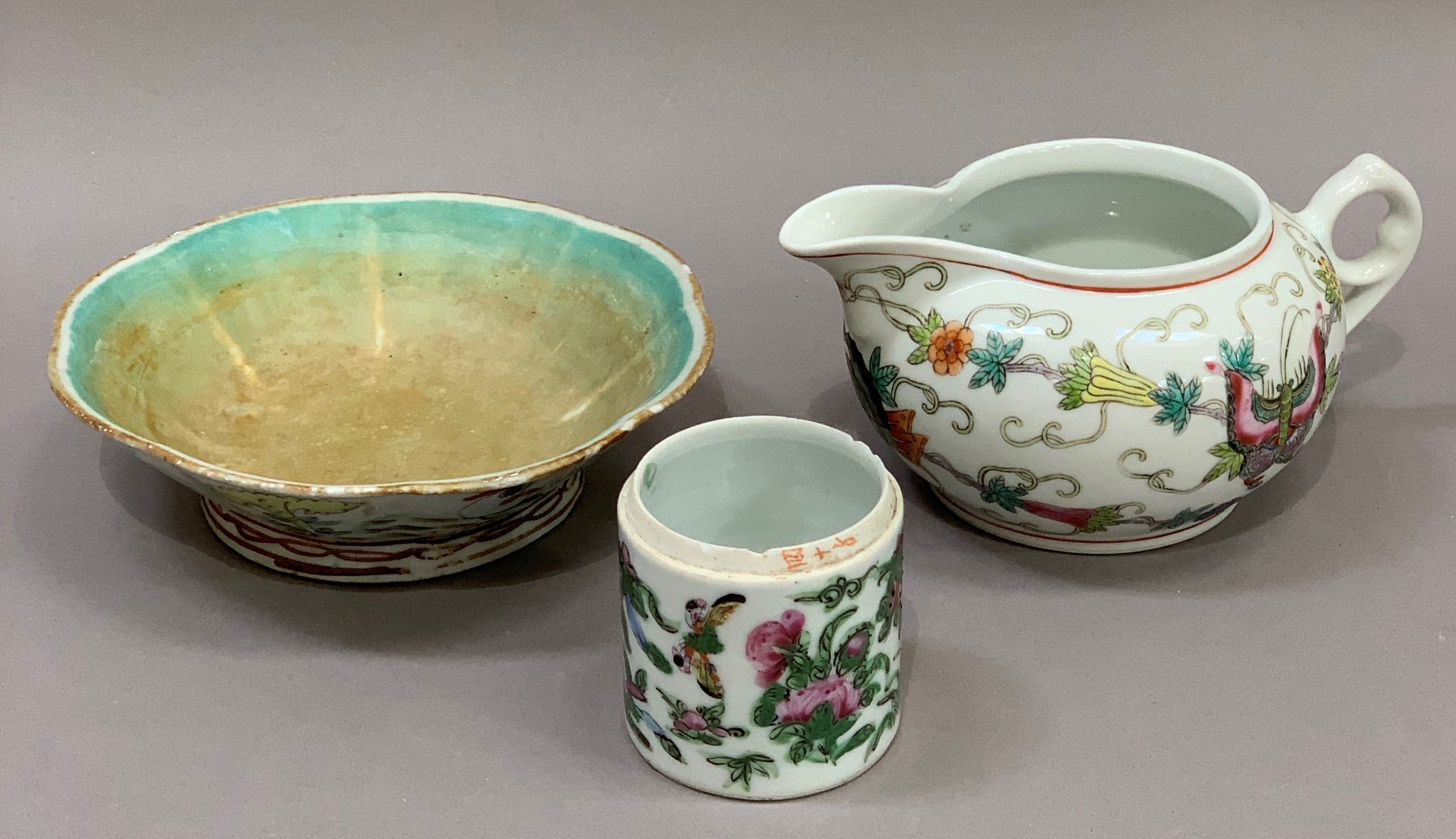 A Chinese compressed globular jug decorated with butterflies, flowers and scrolls within red line