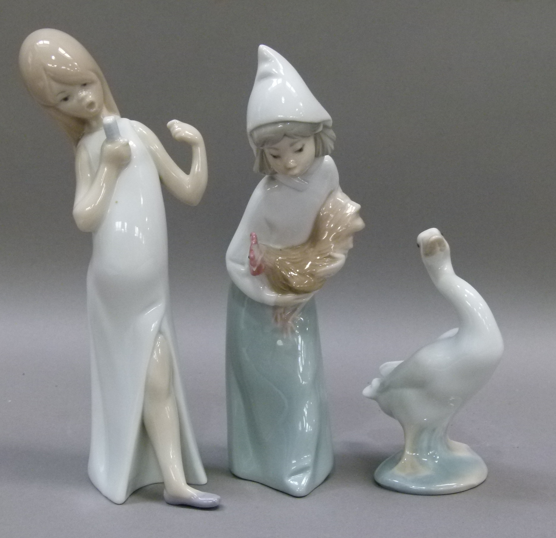 A Lladro figure of a young girl carrying a cockerel, 19cm high, printed mark in blue; another Lladro - Image 2 of 2