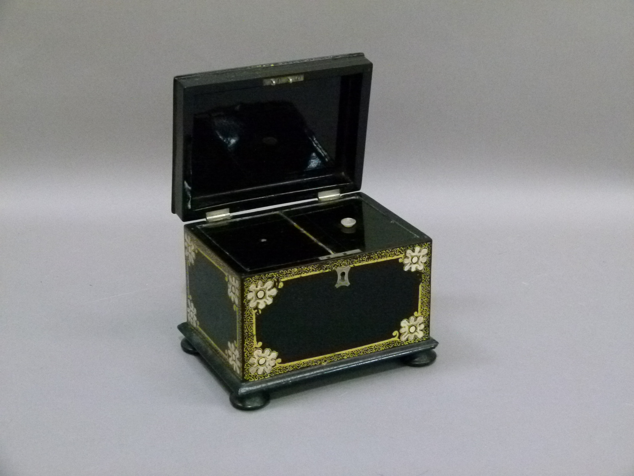 A Victorian black papier mâché tea caddy, the hinged lid with shaped floral filled cartouche on a - Image 2 of 4