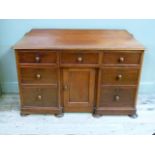 A Victorian mahogany dressing table or desk the top with back and gallery above three short