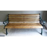 A Victorian style cast iron garden seat with railed back and seat, 164cm wide