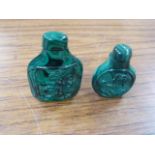 A snuff bottle in malachite, foliate carved to the front within a circular outline and oval section,