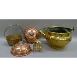 Two copper hot water bottles, a brass jam pan with fixed iron handle and a brass vessel with