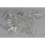 A large quantity of cut glass chandelier parts including drops, crystals, drips and lustres