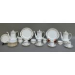 A Paragon coffee service of Belinda pattern including three coffee pots
