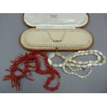 A mid 20th century stick coral necklace fastened with a rolled gold bolt ring Approximate length
