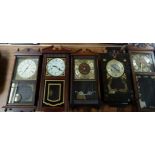 Five mahogany stained wall clocks by various manufacturers