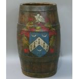 A coopered oak barrel stick stand decorated with an armorial crest, 36cm high