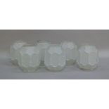 A set of six octagonal frosted glass light shades with foliate panelled bodies, 14cm high