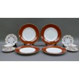 A set of four Royal Crown Derby circular terracotta band dinner plates, 27cm diameter; a pair of