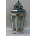 A reproduction tin and wooden tapered octagonal lantern with pierced chimney gallery and dome