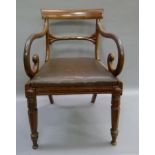A William IV mahogany scroll arm elbow chair on chamfered legs