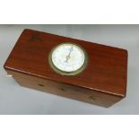 A magnetic indicator contained within a mahogany box, the hinged lid with circular indicator with