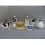 A pair of Victorian Scottish flatback figure groups, together with two Victorian jugs, two mugs,