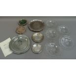 A set of four cut glass plates, a pewter plate -The Queens Plate, limited edition 48/2000 designed