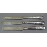 Three silver dessert knives, Kings pattern with engraved blades by CR, London 1910, handles filled