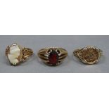 Three dress rings all in 9ct gold variously set with garnet and shell cameo, total approximate