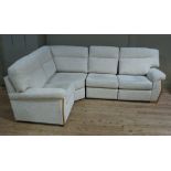 A large modern upholstered L shaped sofa upholstered in cream chenille by High Seat Ltd