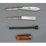 Two mother of pearl faced pen knives, a silver cased propelling pencil and a silver mounted amber