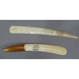 A 19th century ivory folio turner with scroll carved initials MES, stained handle, 28cm long,