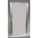 A wall mirror with silvered wooden frame, 114cm x 58cm