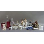 A quantity of decorative ceramics including Capo di Monte figure groups, decanters, cranberry