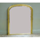 A reproduction arched gilt framed overmantle mirror, 127cm high x 106cm wide
