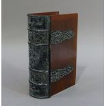 A black Japanned white metal and brown plastic faux book box with strap work hinges, 16cm high