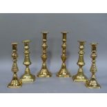 Three pairs of Victorian brass table candlesticks, 28cm high and smaller