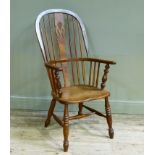 A late 19th century ash and elm high back Windsor elbow chair with pierced splat, bordered seat on