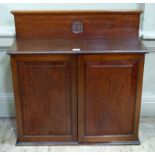 A small Victorian mahogany chiffonier, the upstand with flared top above a central roundel