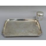 A silver dressing table tray, rectangular with canted corners and flower filled ovolo rim