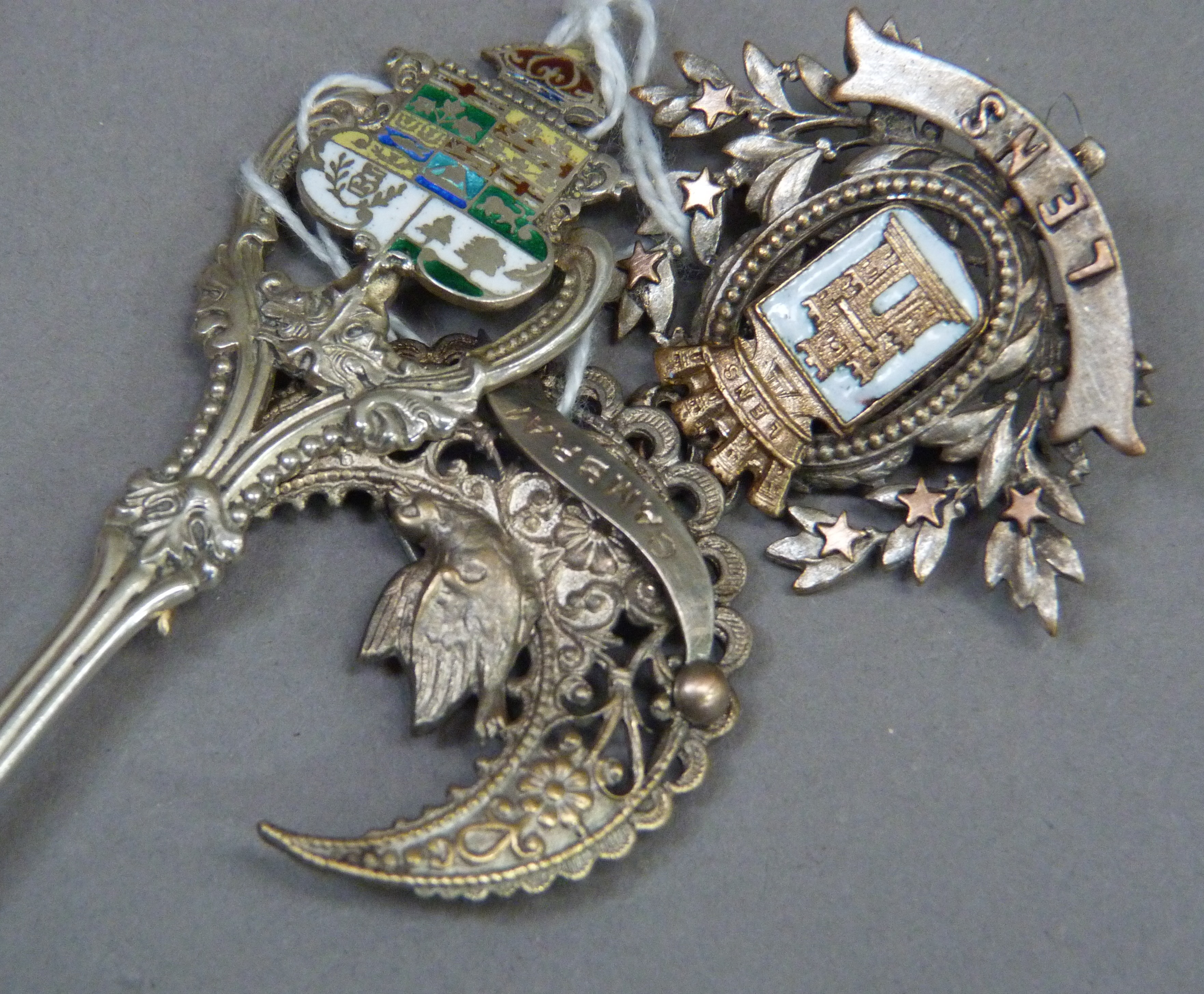 Three items of early to mid 20th tourist ephemera including a base metal Lews brooch, silver - Image 2 of 3