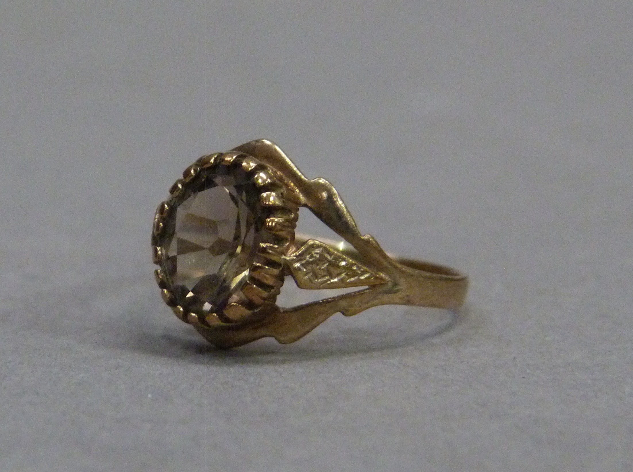 A smoky quartz set dress ring in 9ct gold, approximate weight 1gm