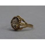 A smoky quartz set dress ring in 9ct gold, approximate weight 1gm