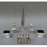 A George VI four division toast rack with angular post and ring handle, by Viners, Sheffield 1939;