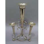 A silver plated table epergne with central larger trumpet and three smaller supported within the
