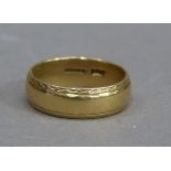 A wedding ring in 18ct gold, approximate weight 6gm