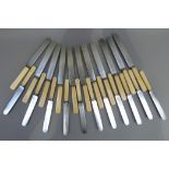 A set of early 20th century ivory handled steel bladed knives including, eleven dinner knives and