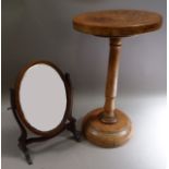 A wooden occasional table with card circular top, turned pillar and spreading circular base, 59cm